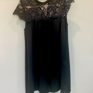 Black knee length dress with lace print at top, size M
